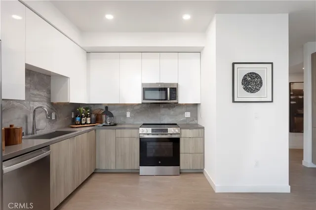 a kitchen with a stove and a microwave