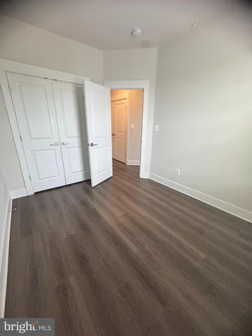 a view of balcony with wooden floor and fence