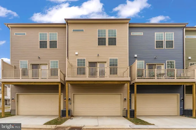 a front view of a building with many windows