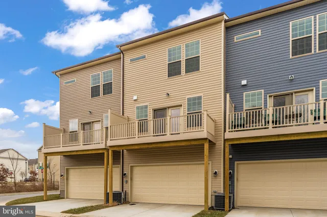 a front view of a house with a garage