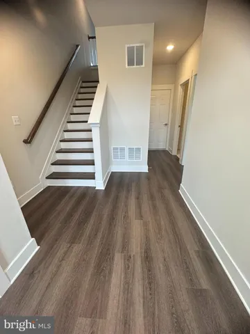 a view of wooden floor in an empty room