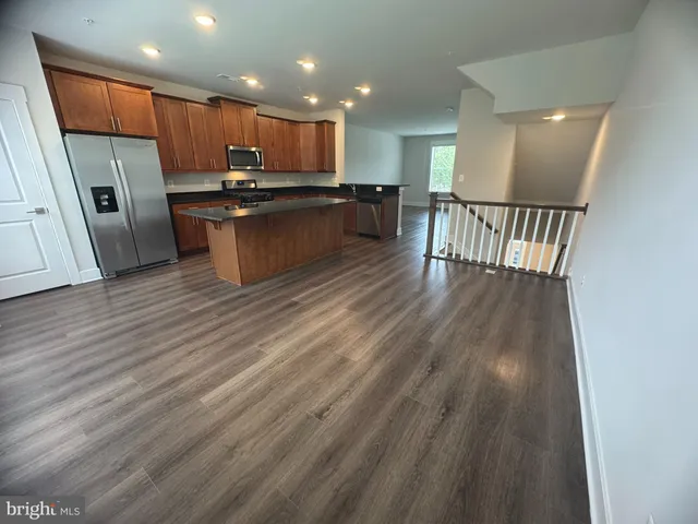 a view of kitchen with wooden floor