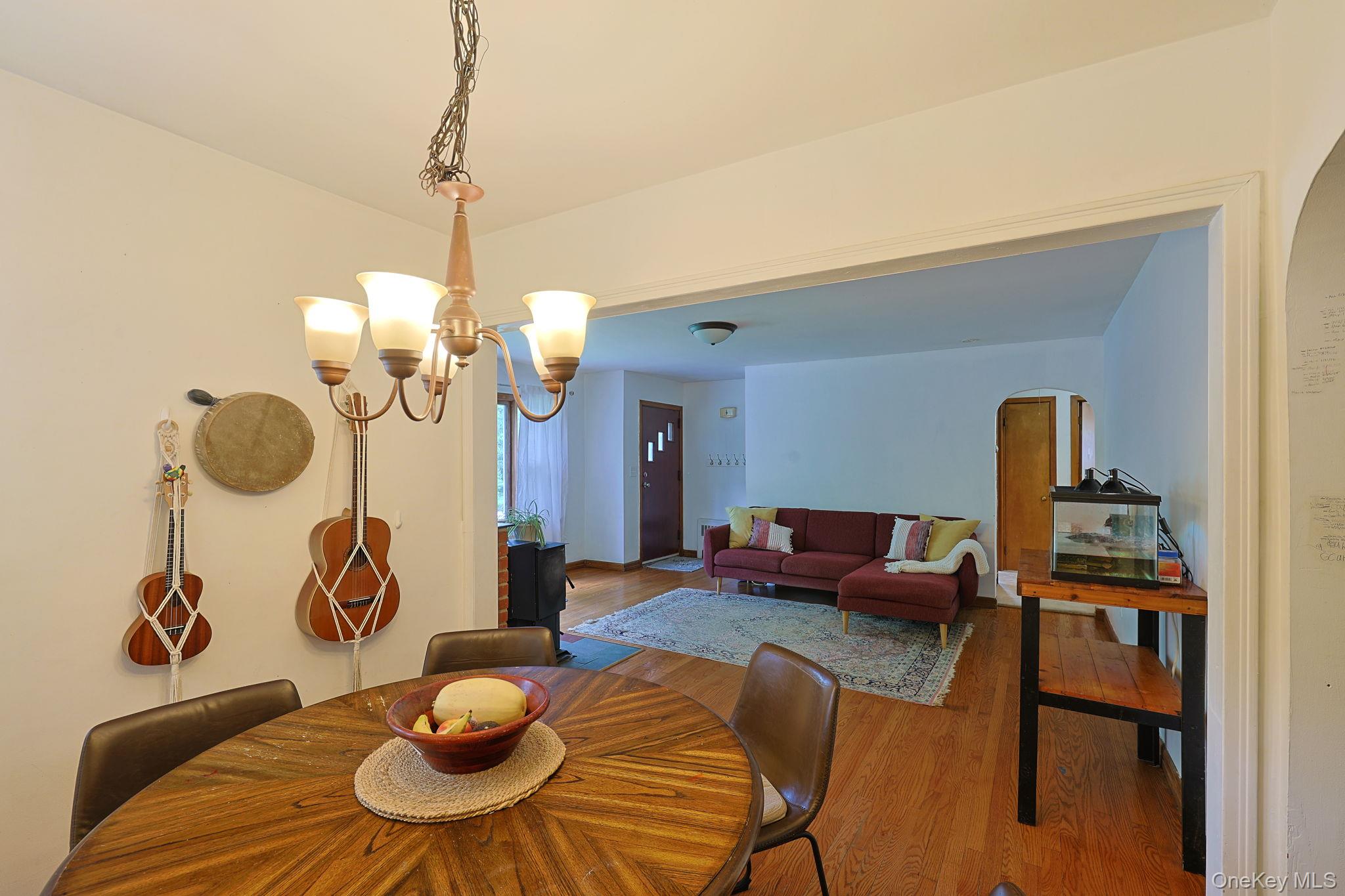 178 Mt Airy Road New Windsor, NY 12553 - Photo 7 of 31 a living room with furniture a dining table and chairs with wooden floor