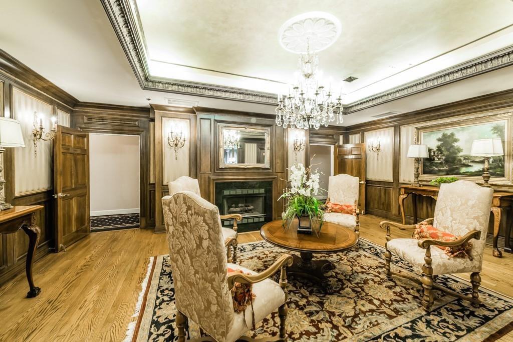 2865 Lenox Road Northeast, Unit 407 Atlanta, GA 30324 - Photo 3 of 27 a living room with fireplace furniture and a chandelier