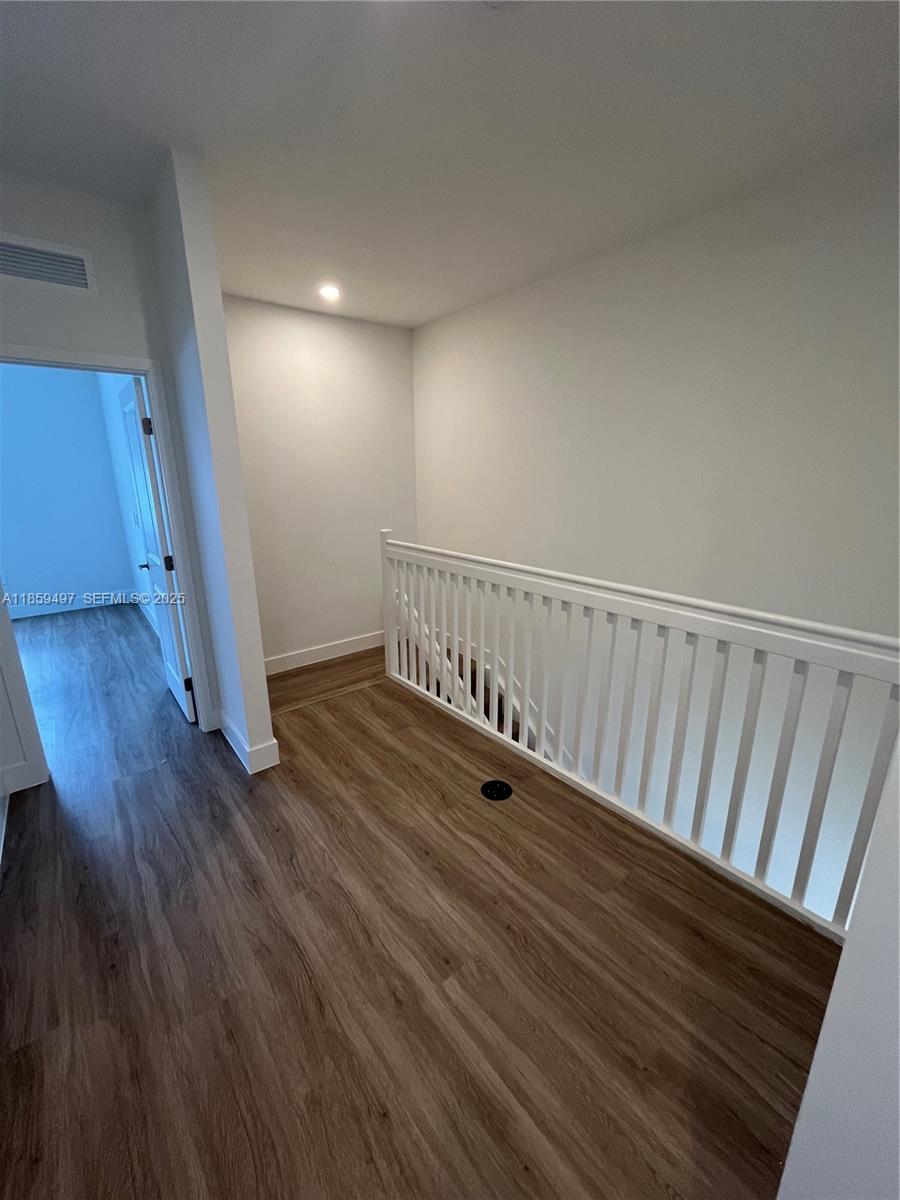 34515 Southwest 191st Court Homestead, FL 33034 - Photo 18 of 25 a view of hallway with wooden floor