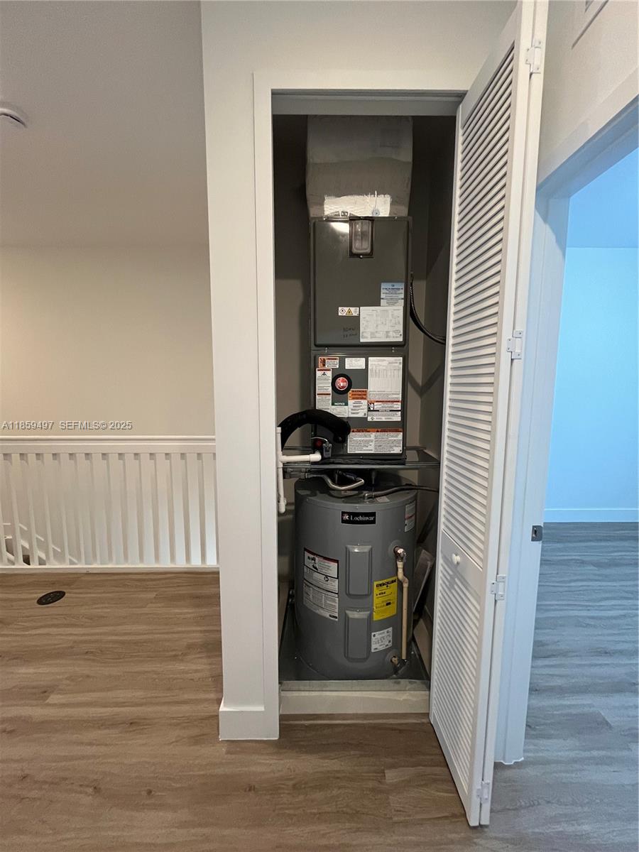 34515 Southwest 191st Court Homestead, FL 33034 - Photo 19 of 25 a view of a hallway with wooden floor and closet