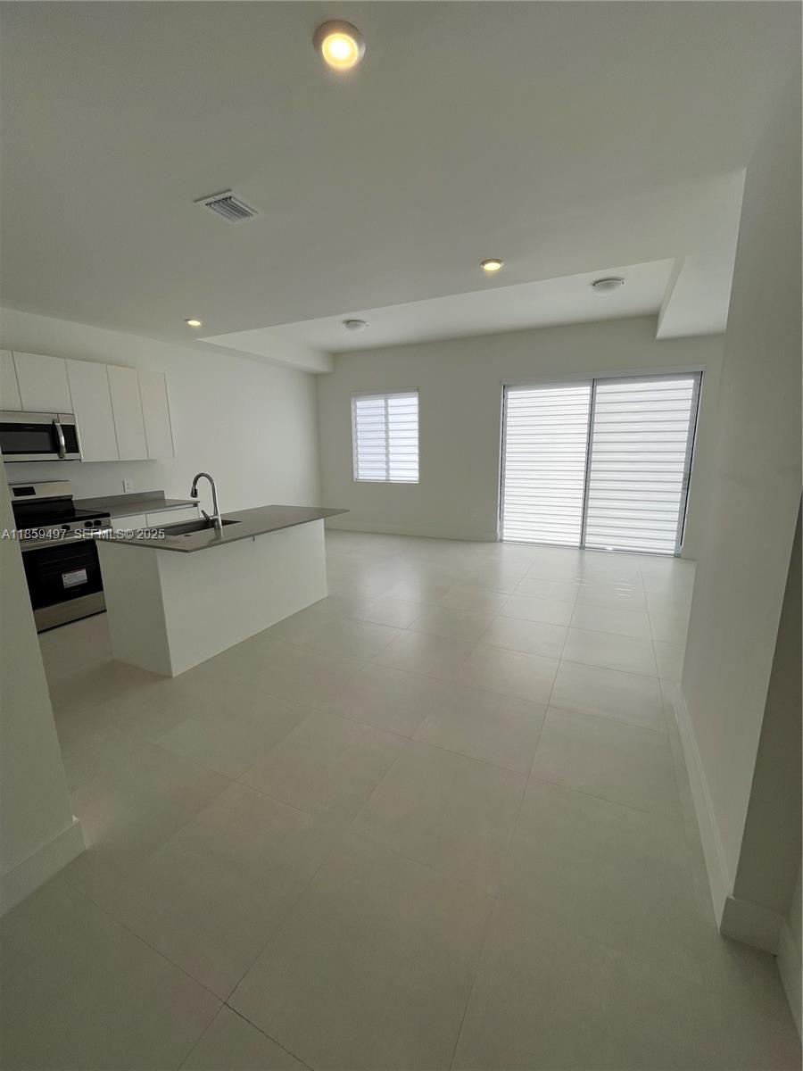 34515 Southwest 191st Court Homestead, FL 33034 - Photo 5 of 25 a view of a kitchen with a sink and cabinets