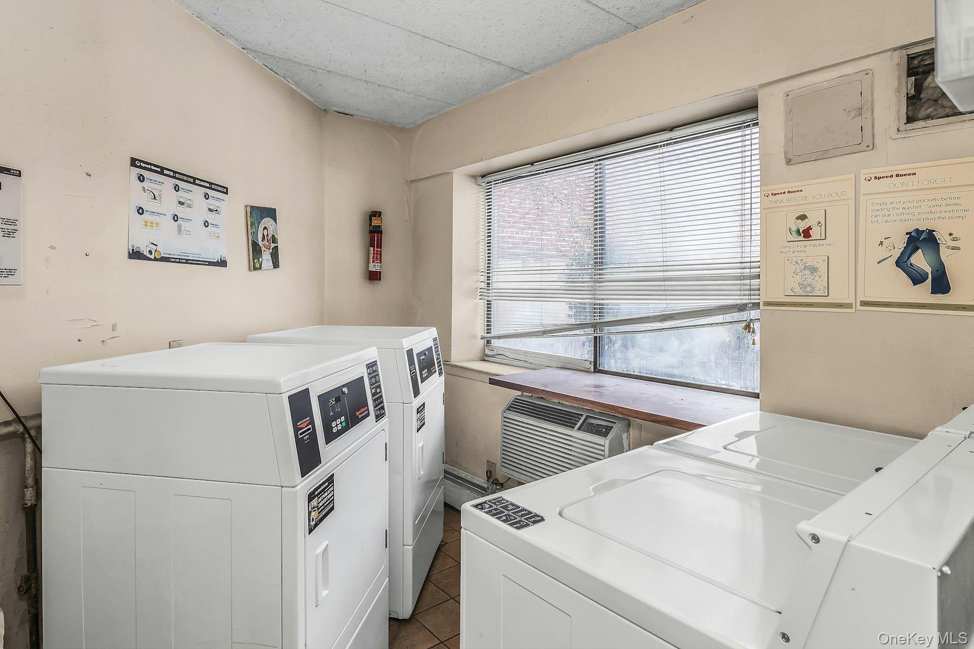 54-09 108th Street, Unit 1C Queens, NY 11368 - Photo 14 of 15 a utility room with dryer and washer