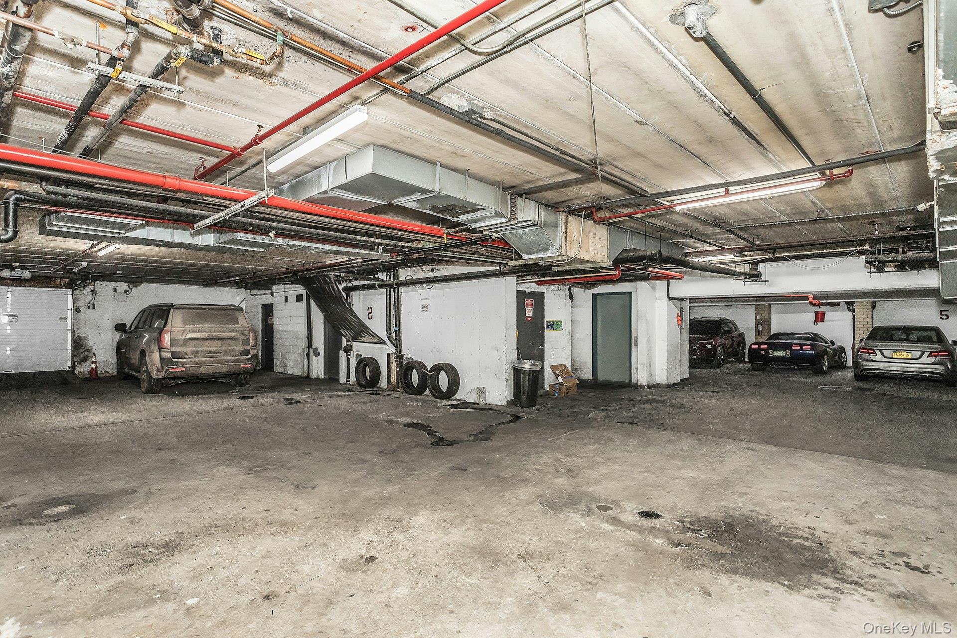 54-09 108th Street, Unit 1C Queens, NY 11368 - Photo 15 of 15 a view of parking garage with cars