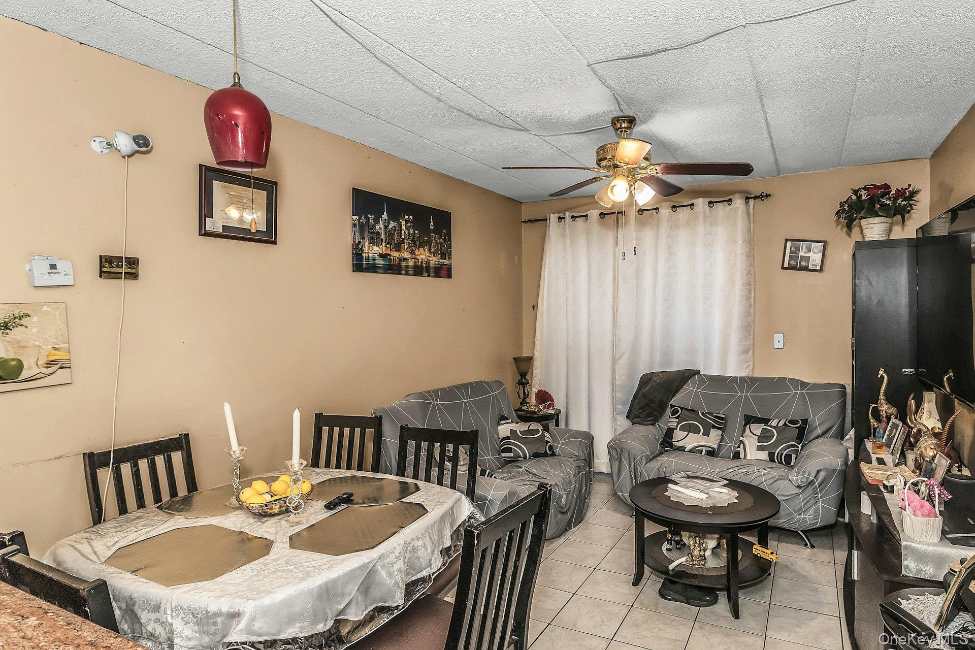 54-09 108th Street, Unit 1C Queens, NY 11368 - Photo 4 of 15 a view of a livingroom with furniture and entryway