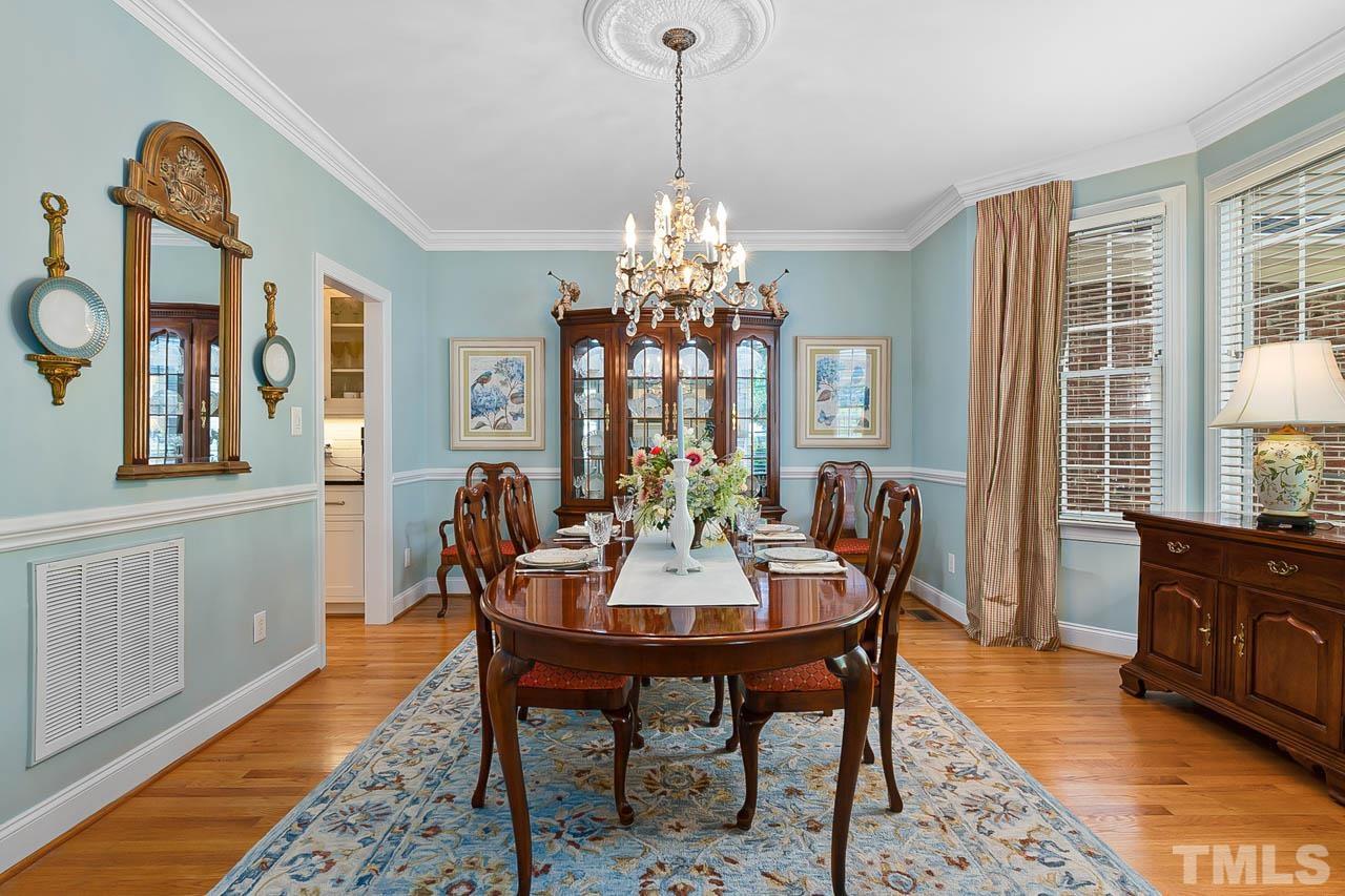 3500 Proprietor Way Raleigh, NC 27612 - Photo 15 of 47 a dining room with furniture a chandelier and wooden floor