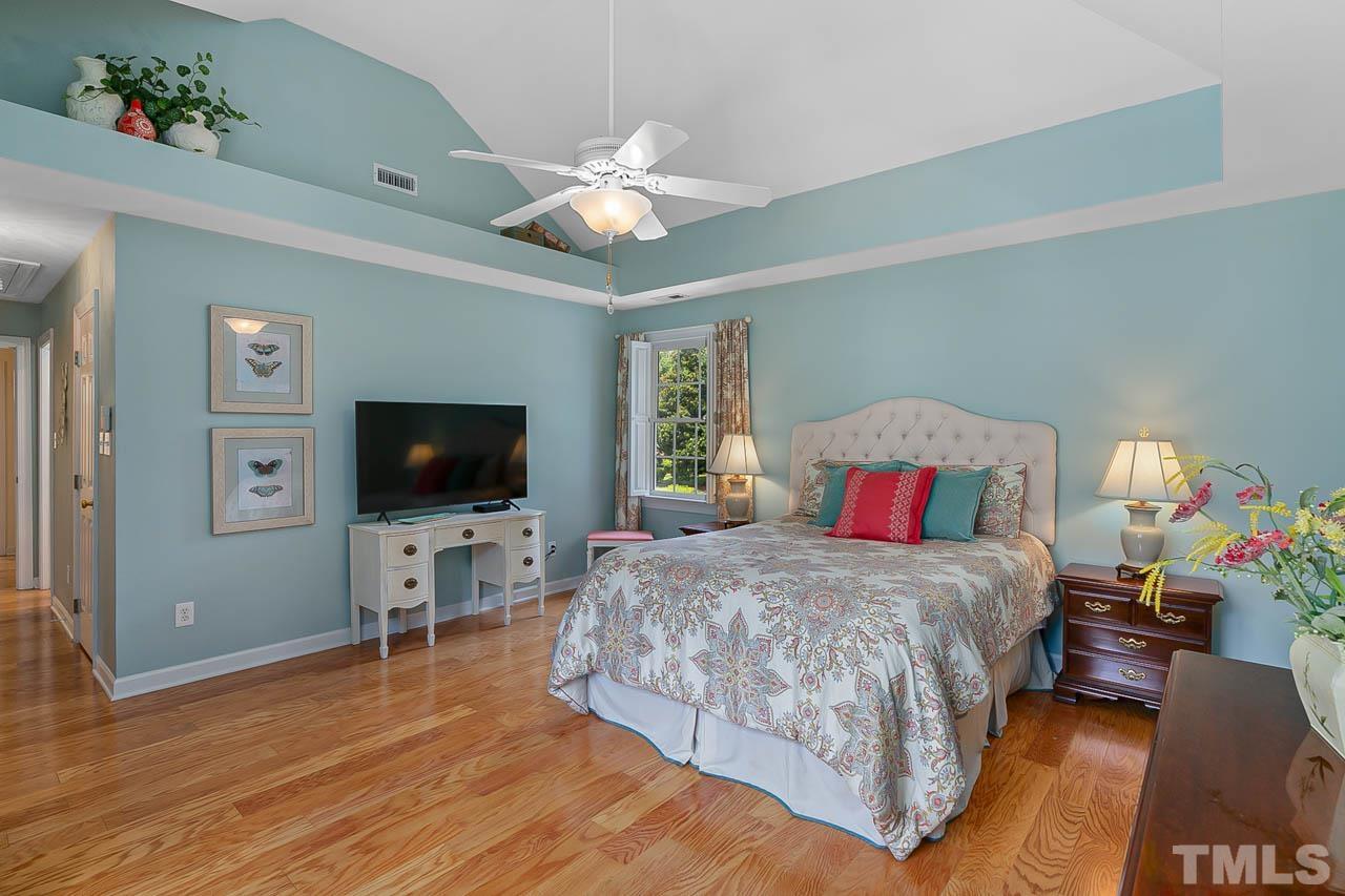 3500 Proprietor Way Raleigh, NC 27612 - Photo 29 of 47 a bedroom with a bed and a flat screen tv