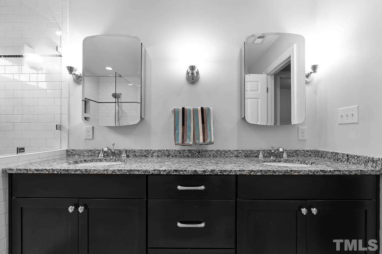 3500 Proprietor Way Raleigh, NC 27612 - Photo 33 of 47 a bathroom with a granite countertop sink vanity and mirror
