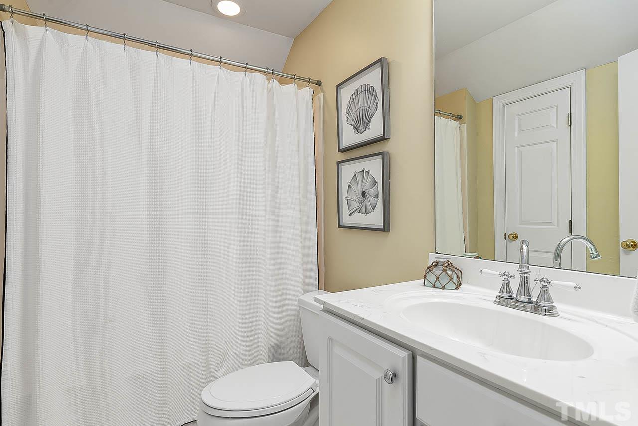 3500 Proprietor Way Raleigh, NC 27612 - Photo 36 of 47 a bathroom with a sink and a mirror