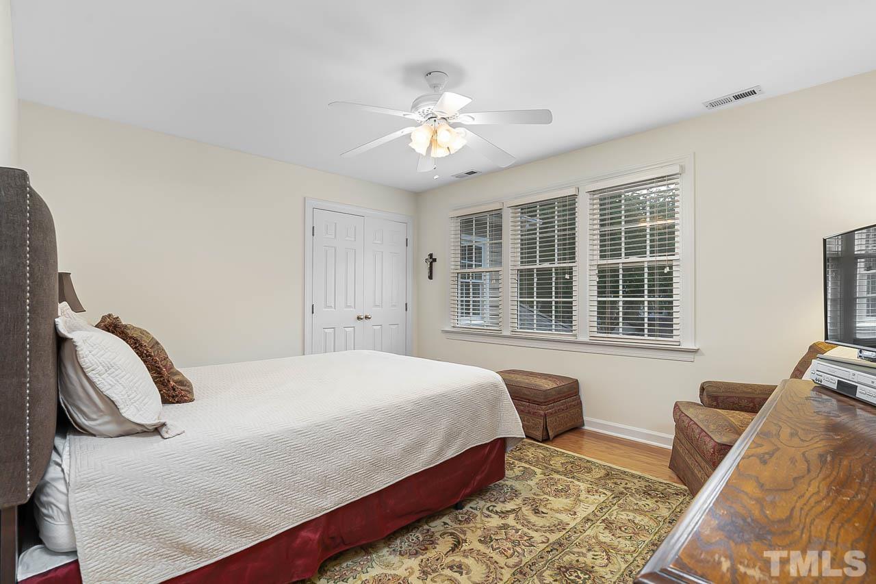 3500 Proprietor Way Raleigh, NC 27612 - Photo 37 of 47 a bedroom with a bed and wooden floor