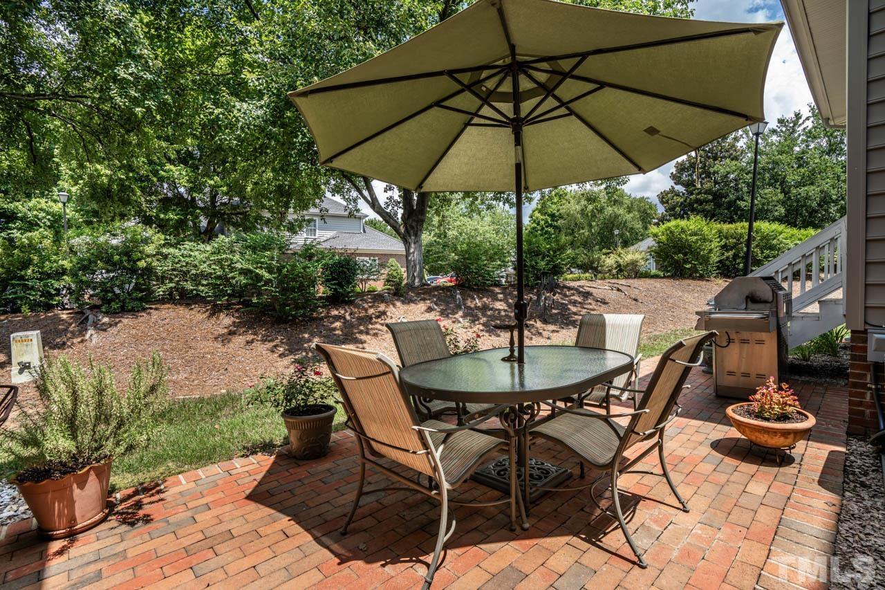 3500 Proprietor Way Raleigh, NC 27612 - Photo 43 of 47 a patio with a patio table and chairs
