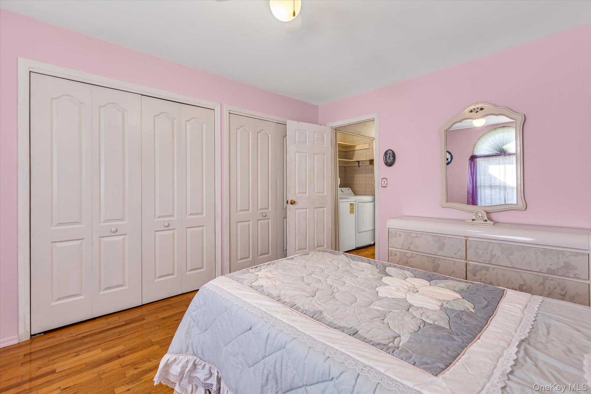 20 Primrose Lane North Babylon, NY 11703 - Photo 11 of 19 a spacious bedroom with a bed and a mirror