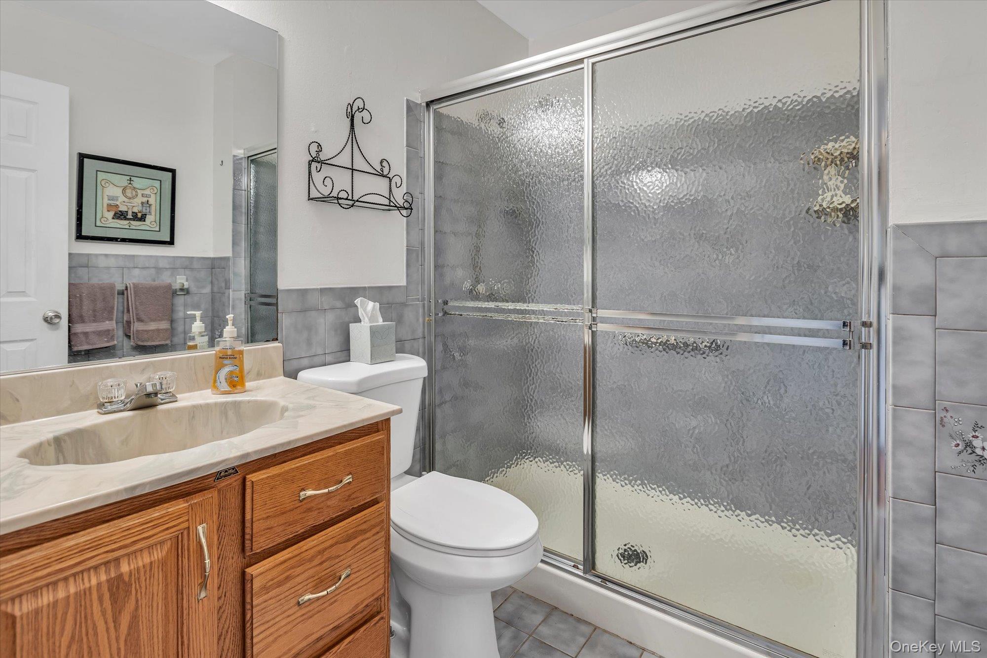 20 Primrose Lane North Babylon, NY 11703 - Photo 12 of 19 a bathroom with a sink toilet and shower