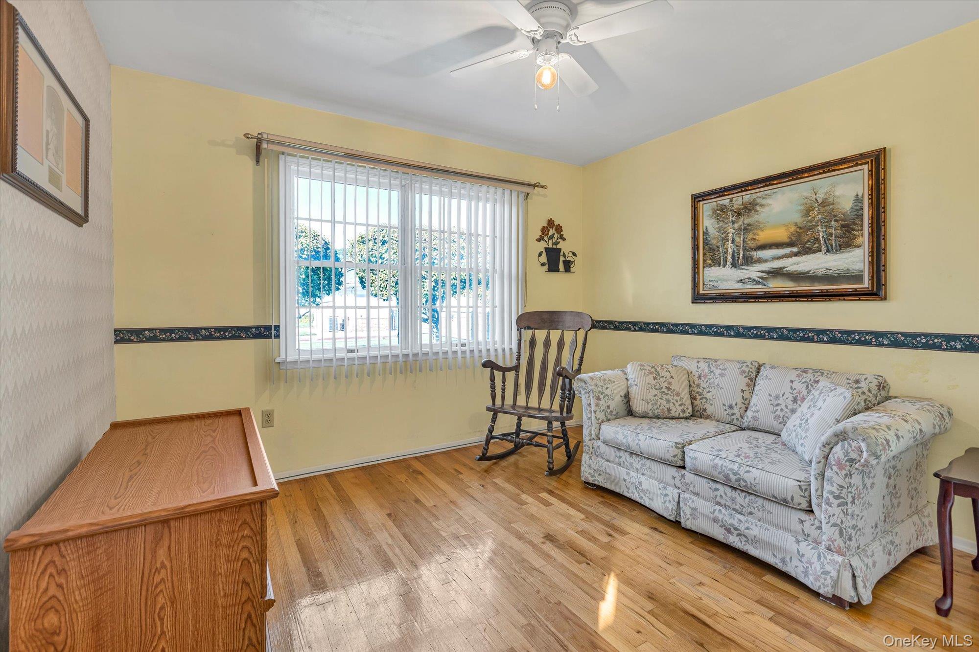 20 Primrose Lane North Babylon, NY 11703 - Photo 13 of 19 a living room with furniture and a large window