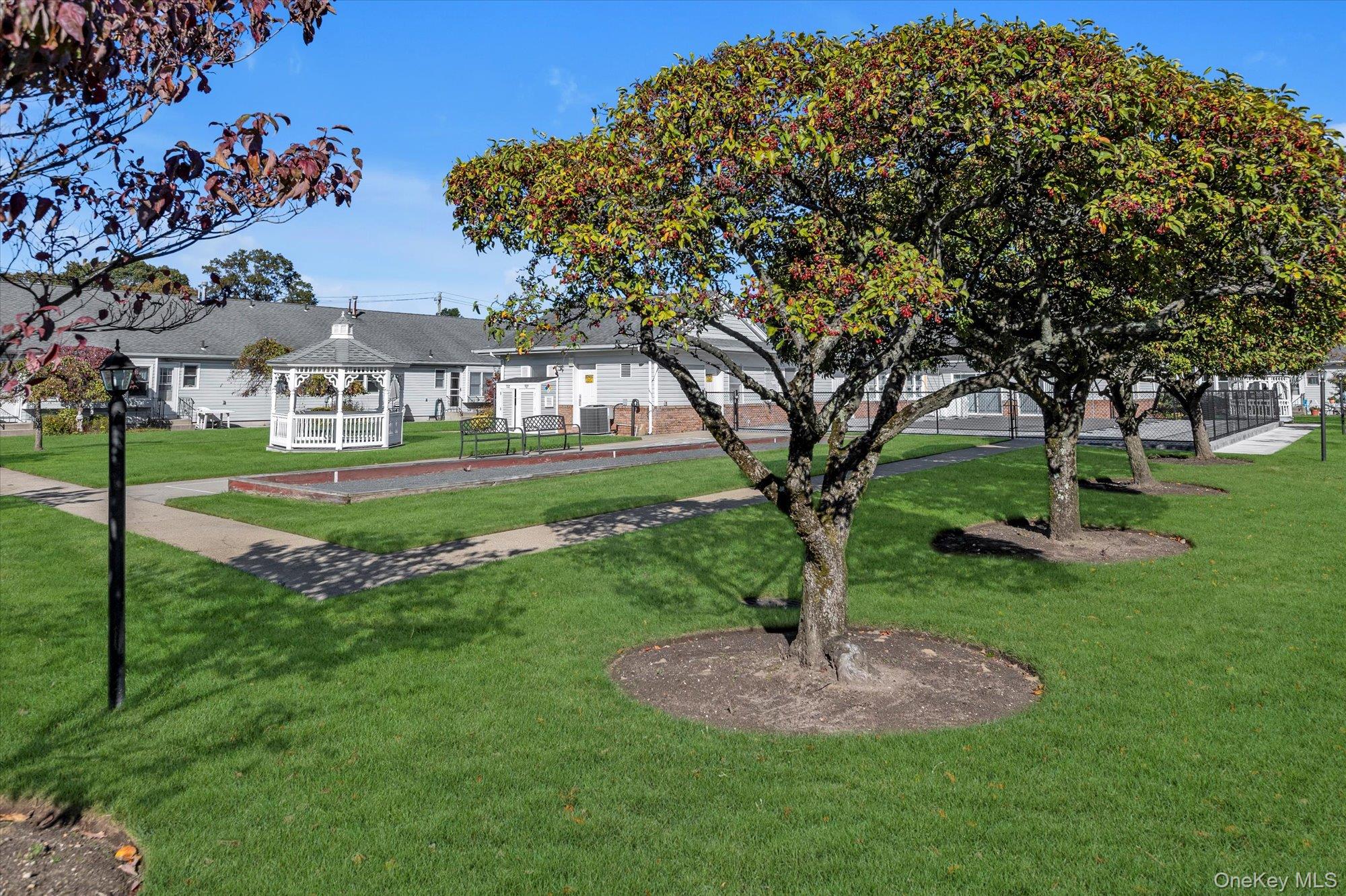 20 Primrose Lane North Babylon, NY 11703 - Photo 17 of 19 a front view of a house with a yard