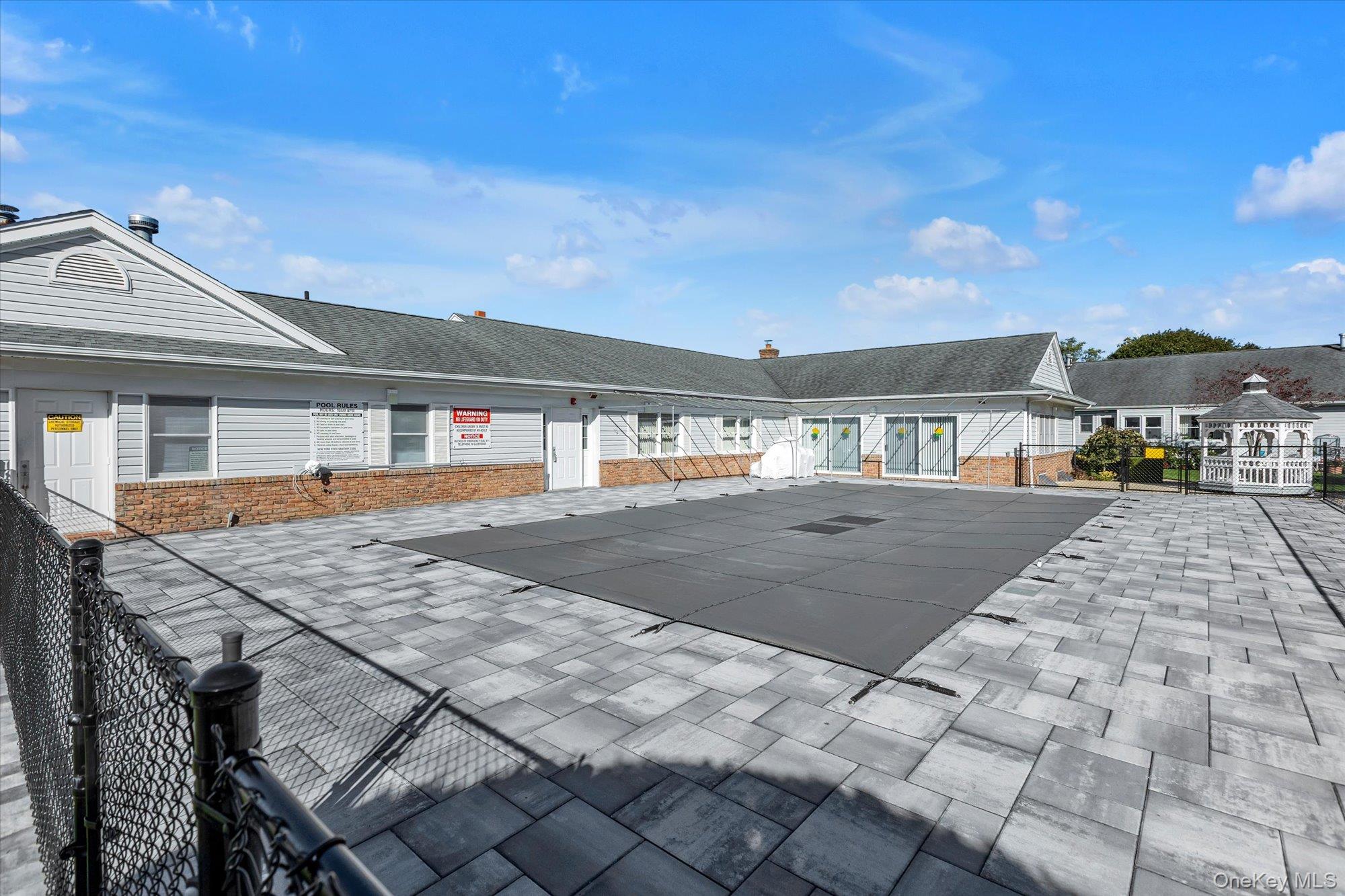 20 Primrose Lane North Babylon, NY 11703 - Photo 19 of 19 a backyard of a house with table and chairs