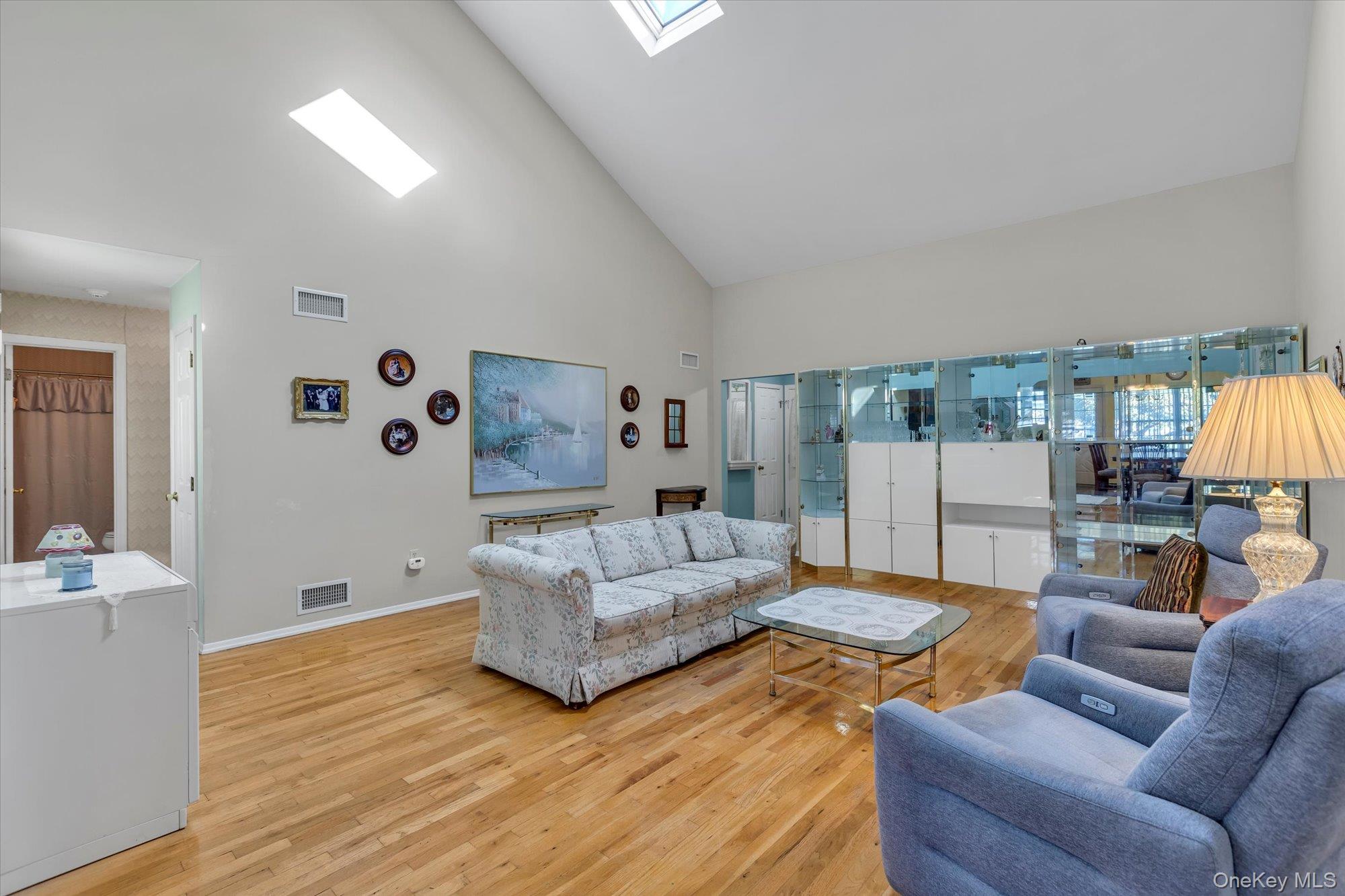 20 Primrose Lane North Babylon, NY 11703 - Photo 3 of 19 a living room with furniture and wooden floor
