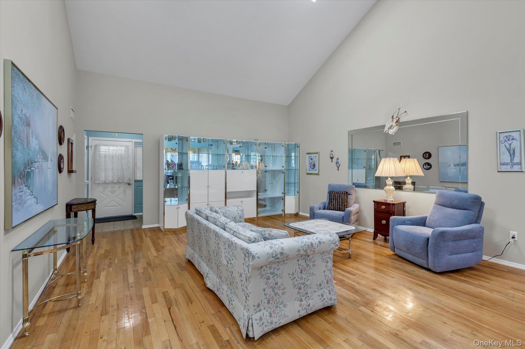 20 Primrose Lane North Babylon, NY 11703 - Photo 4 of 19 a living room with furniture and a wooden floor