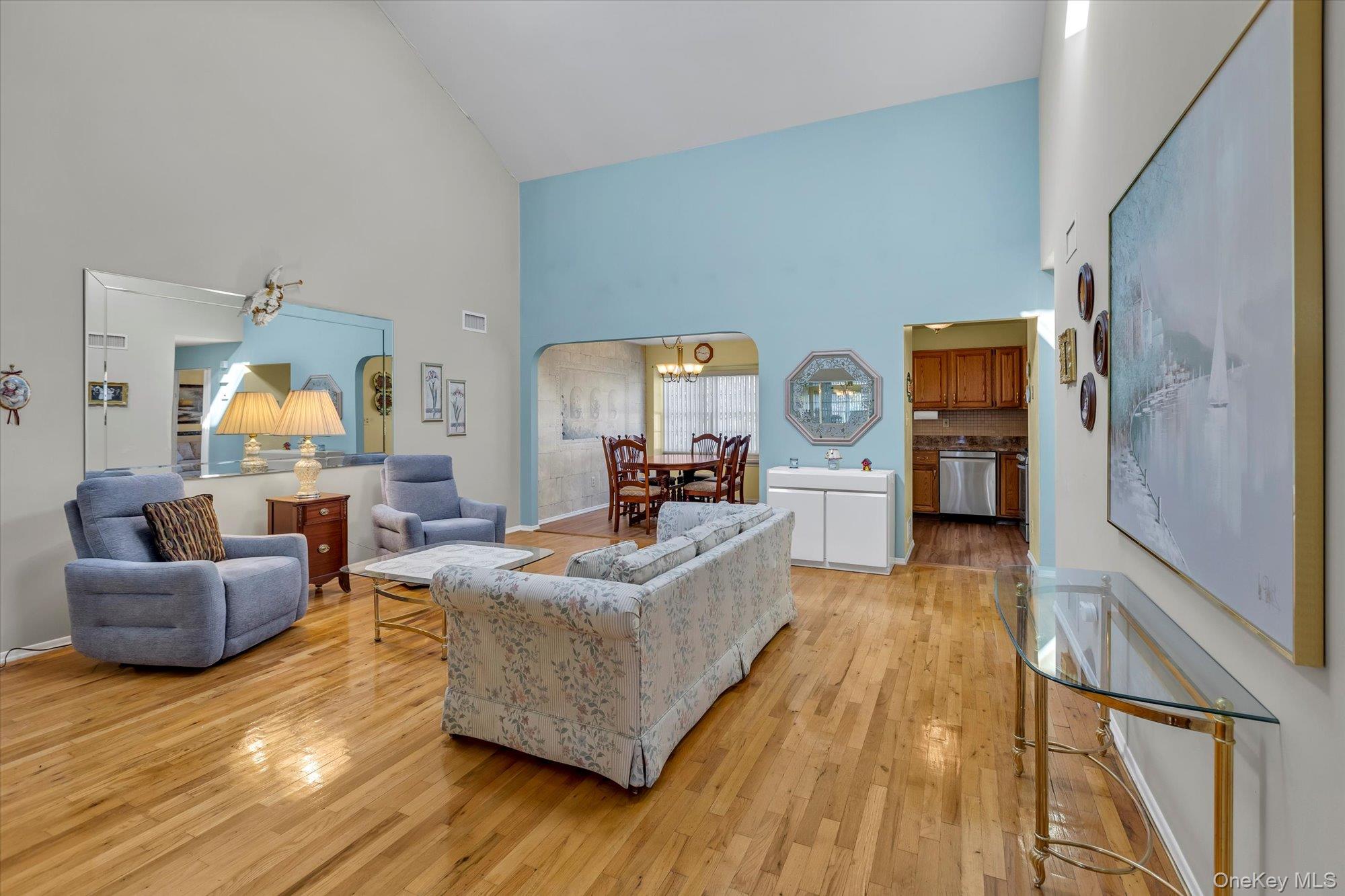 20 Primrose Lane North Babylon, NY 11703 - Photo 5 of 19 a living room with furniture and a wooden floor