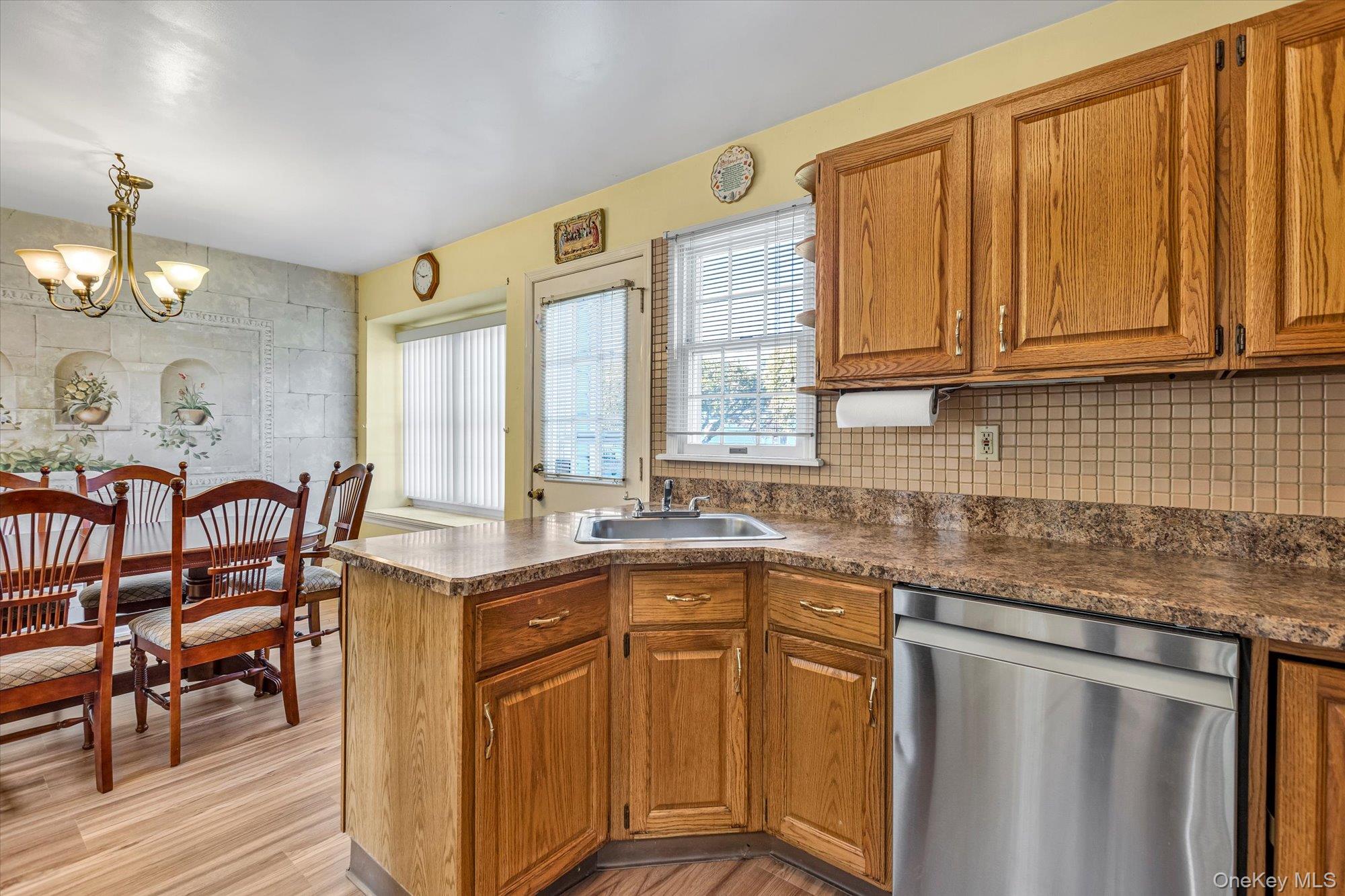 20 Primrose Lane North Babylon, NY 11703 - Photo 7 of 19 a kitchen with stainless steel appliances granite countertop a sink and cabinets