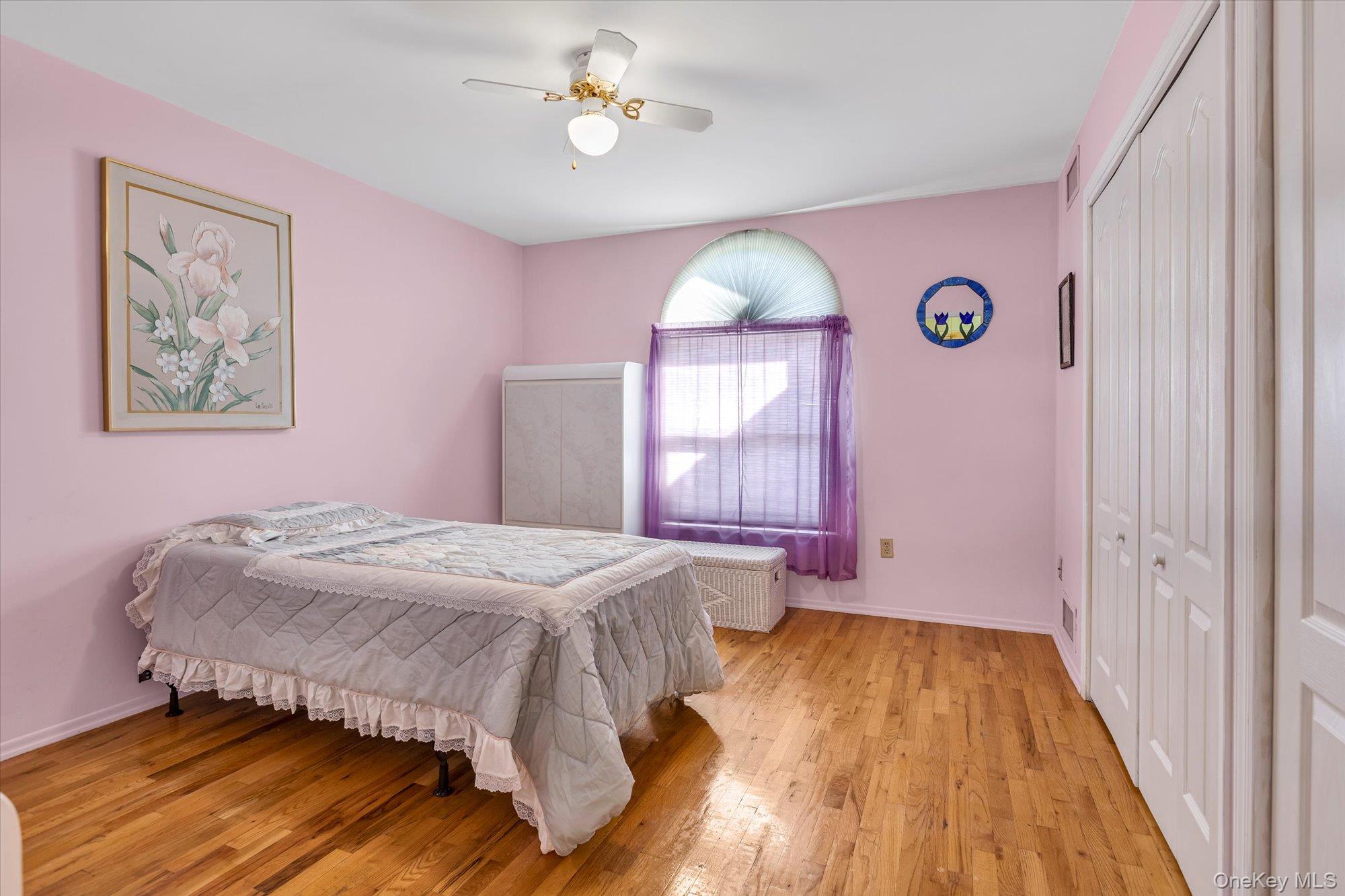 20 Primrose Lane North Babylon, NY 11703 - Photo 10 of 19 a bedroom with a bed and a window