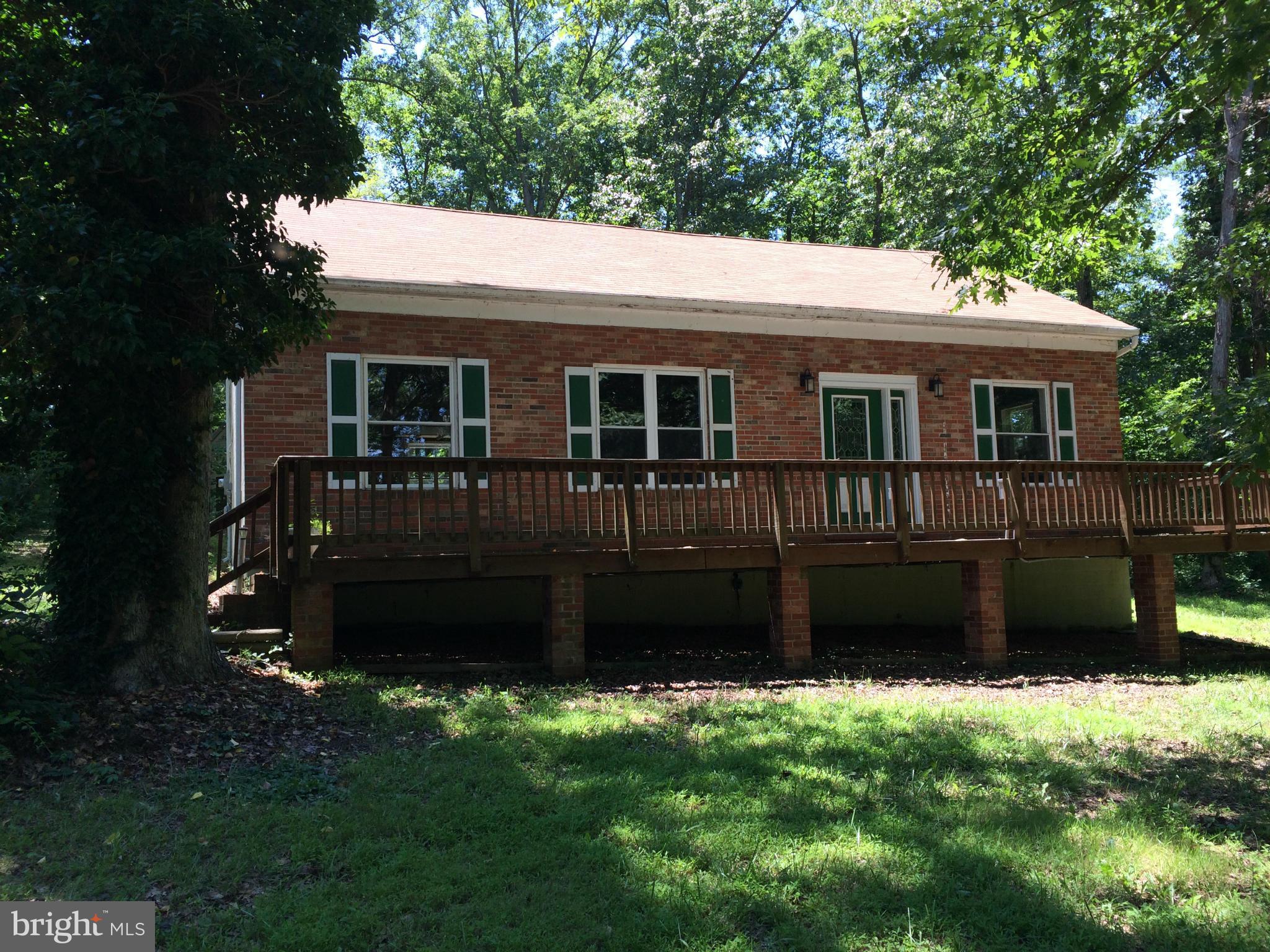 352 Manor Road Front Royal, VA 22630 - Photo 1 of 17 a front view of a house with a garden