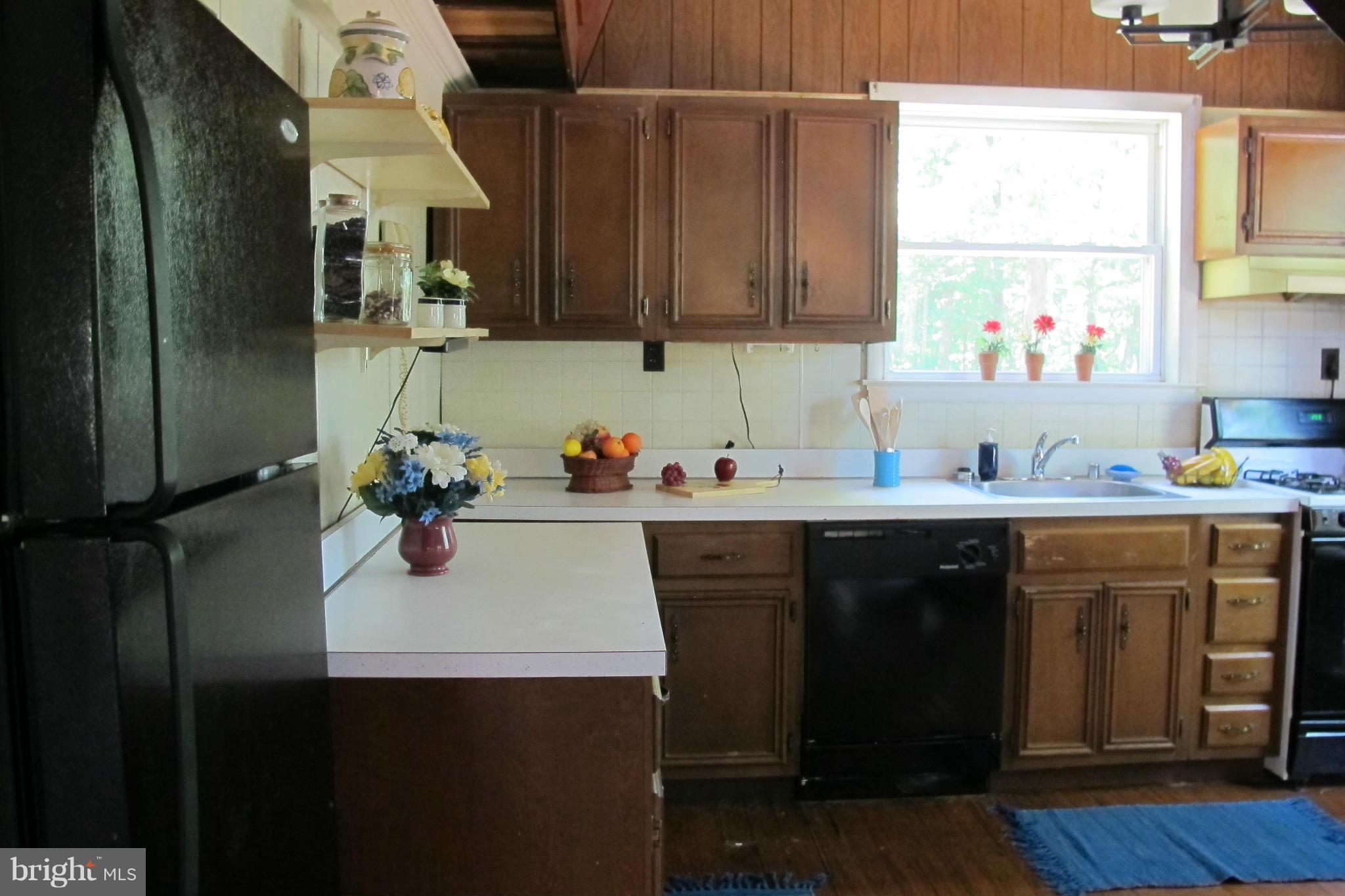 352 Manor Road Front Royal, VA 22630 - Photo 8 of 17 a kitchen with sink cabinets and window
