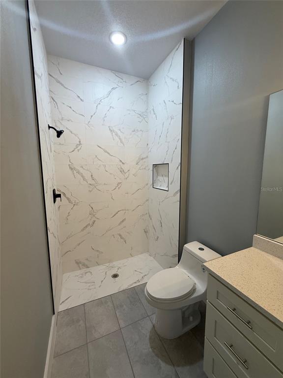 14919 Southwest 46th Circle Ocala, FL 34473 - Photo 13 of 22 a bathroom with a toilet and a shower