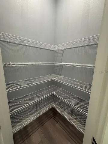 a view of a room with racks on the wall