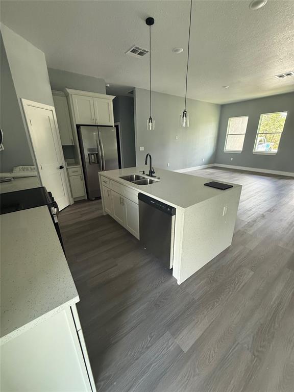 14919 Southwest 46th Circle Ocala, FL 34473 - Photo 7 of 22 a kitchen with a sink a refrigerator and window