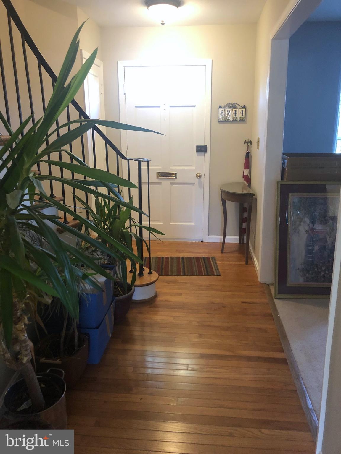 8244 Carrleigh Parkway Springfield, VA 22152 - Photo 7 of 25 a view of entryway and hall with wooden floor