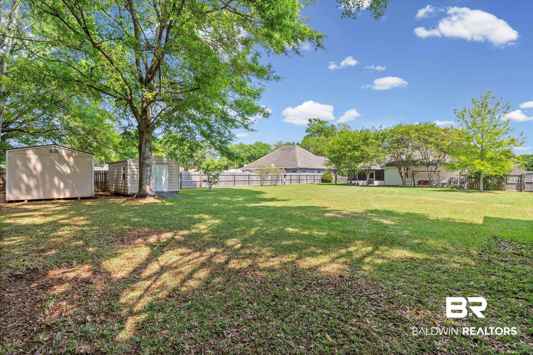 25825 Austin Road Daphne, AL 36526 - Photo 19 of 30 Fenced backyard with a storage shed