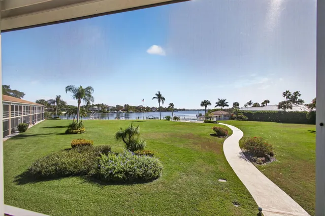 a view of a lake with houses in the back