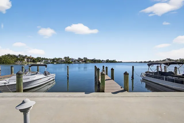 a living room with furniture and a kitchen view