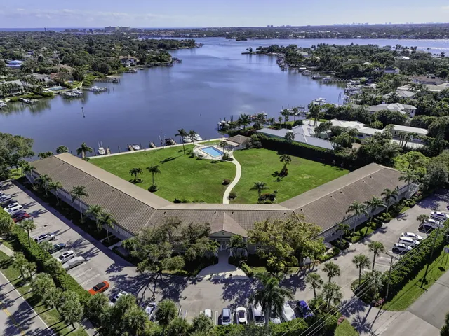 an aerial view of a house with a lake view