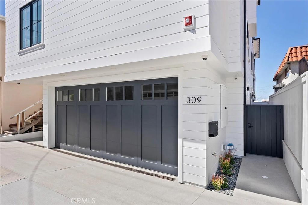 309 Crest Drive Manhattan Beach, CA 90266 - Photo 1 of 27 a view of a house with a door and wooden walls