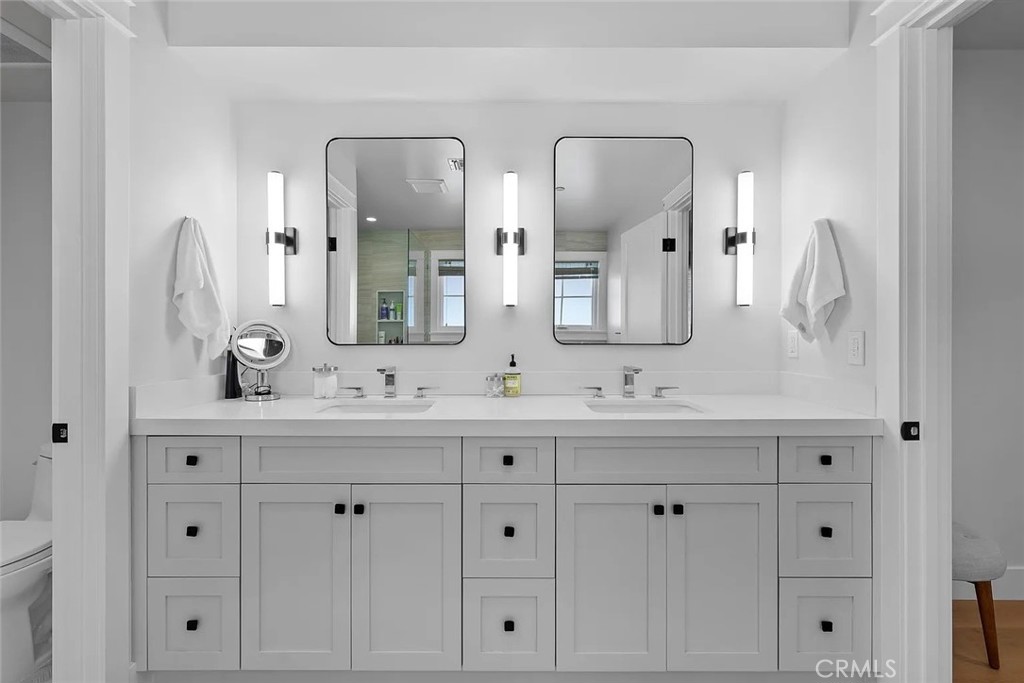 309 Crest Drive Manhattan Beach, CA 90266 - Photo 16 of 27 a bathroom with white cabinets and a sink