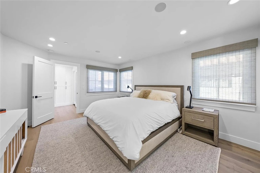 309 Crest Drive Manhattan Beach, CA 90266 - Photo 18 of 27 a bedroom with a bed and a window