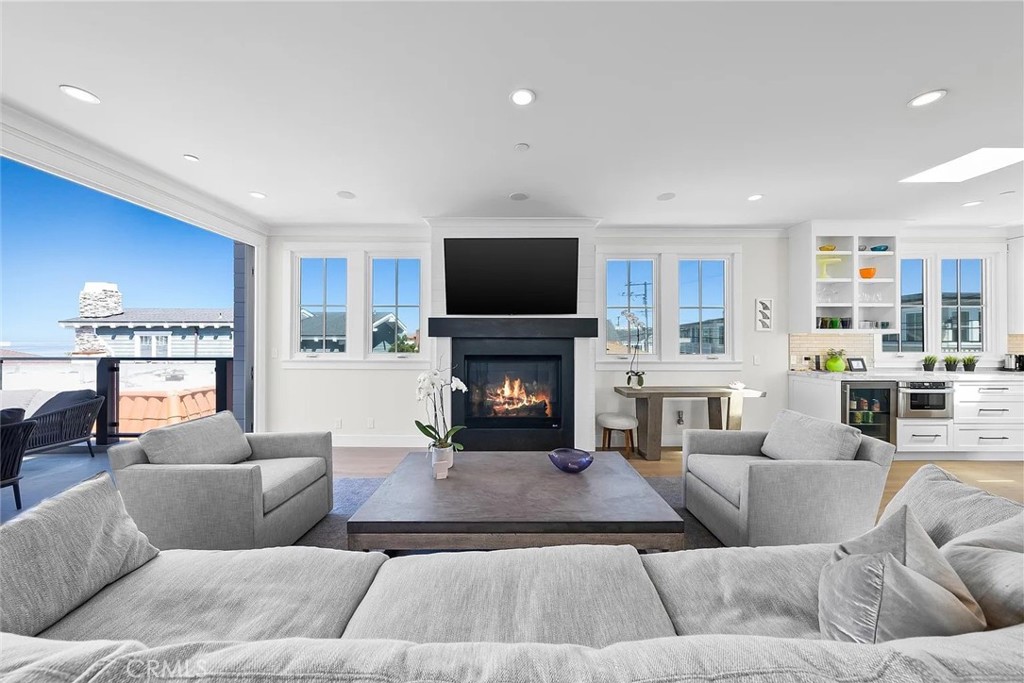 309 Crest Drive Manhattan Beach, CA 90266 - Photo 2 of 27 a living room with furniture and a fireplace
