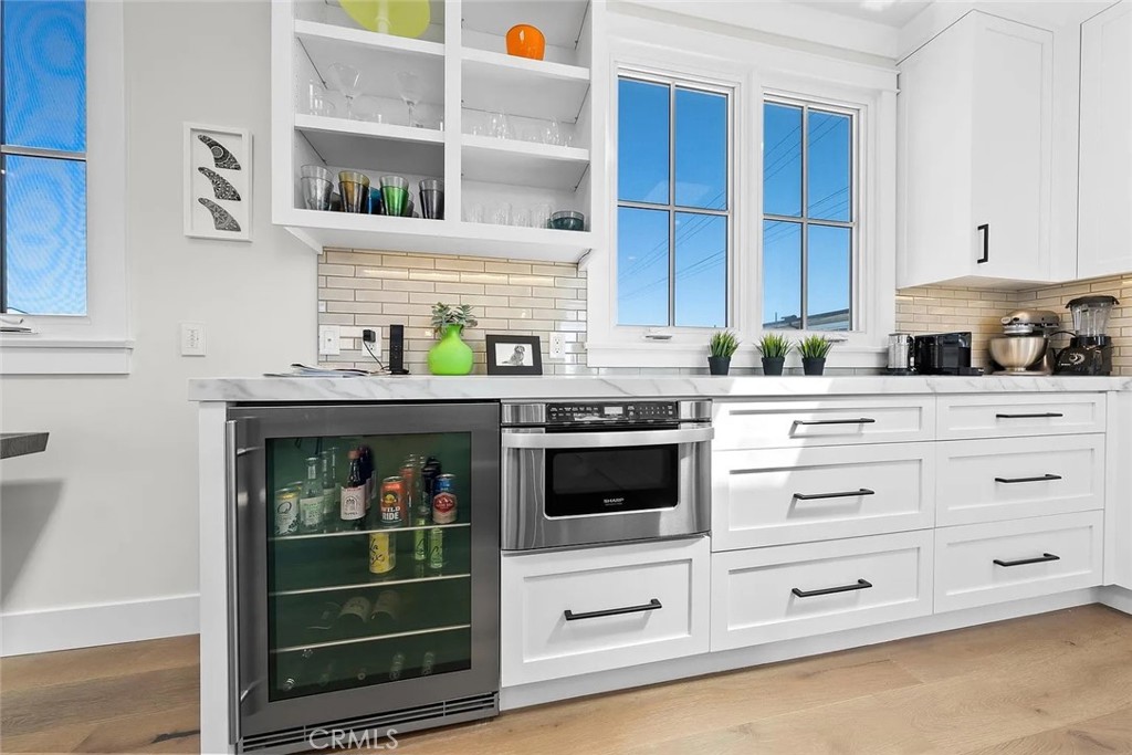 309 Crest Drive Manhattan Beach, CA 90266 - Photo 7 of 27 a kitchen with stainless steel appliances cabinets and window