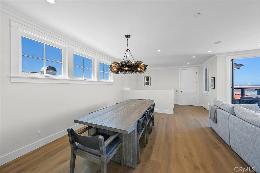 309 Crest Drive Manhattan Beach, CA 90266 - Photo 9 of 27 a view of a dining room with furniture and wooden floor