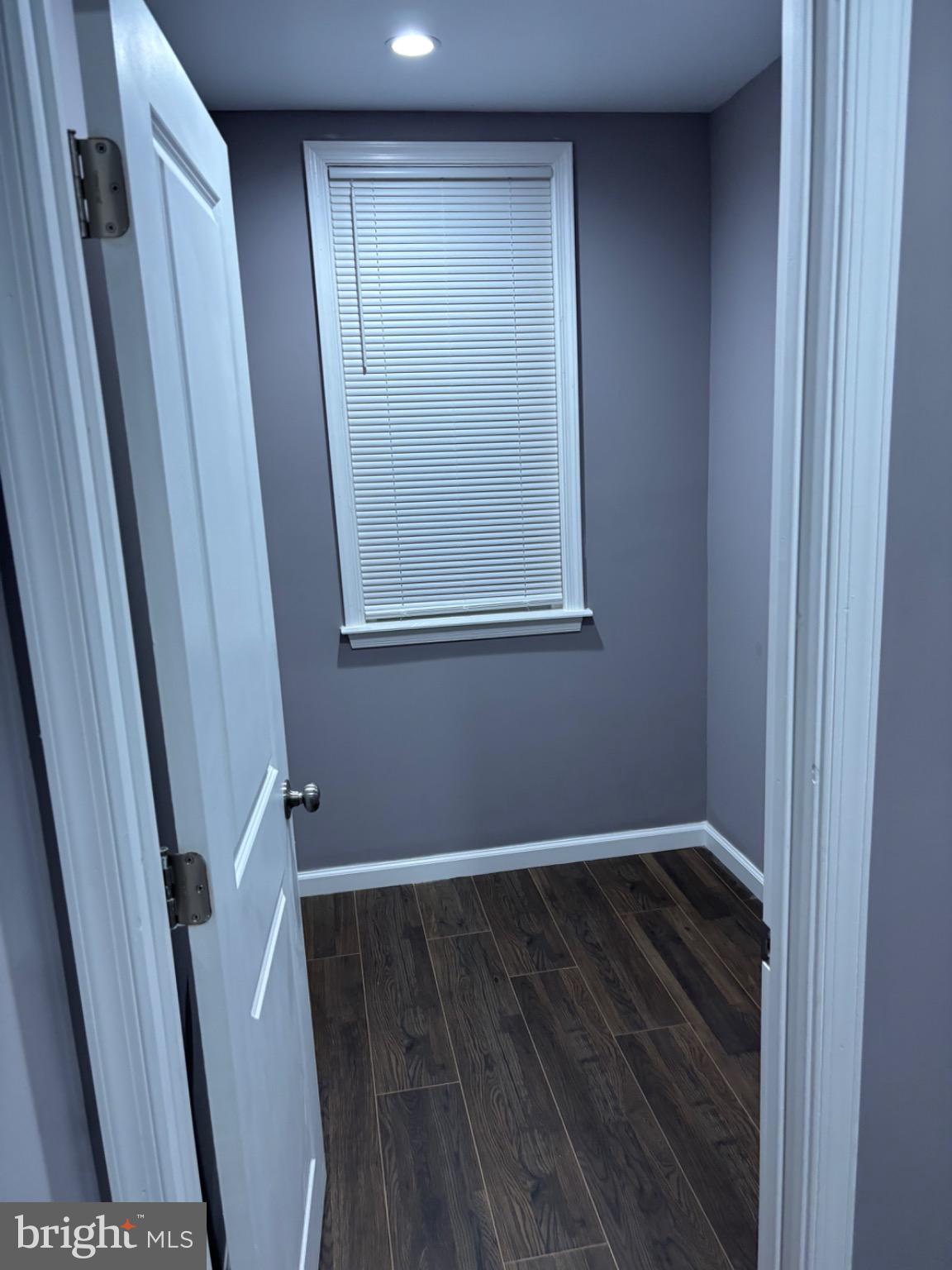 2113 Kennedy Street Philadelphia, PA 19124 - Photo 6 of 10 a view of an empty room with wooden floor and a window