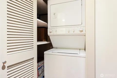 a close up view of a washer and dryer in a white door