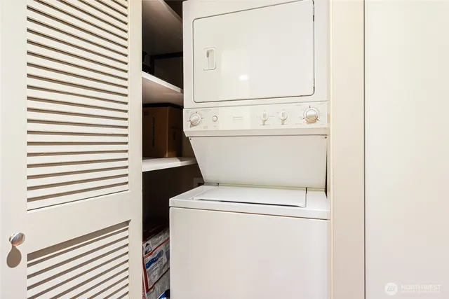 a close up view of a washer and dryer in a white door