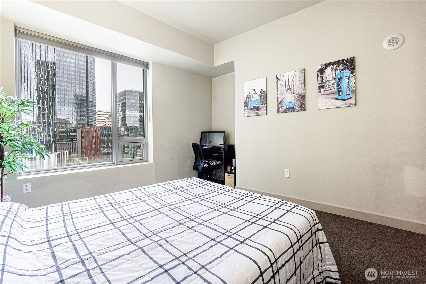 900 Lenora Street, Unit 804 Seattle, WA 98121 - Photo 20 of 38 a bedroom with a large bed and a window